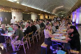 Dnipro residents write dictation in subway on Constitution Day